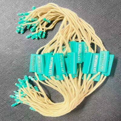 Étiquetage des vêtements Étiquette de fixation en plastique Technique standard en relief adaptée à diverses applications d'étiquetage des vêtements